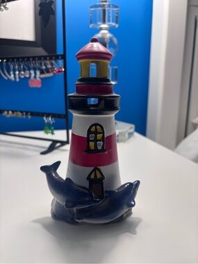 Decorative Red & White Lighthouse Figurine with Blue Dolphins